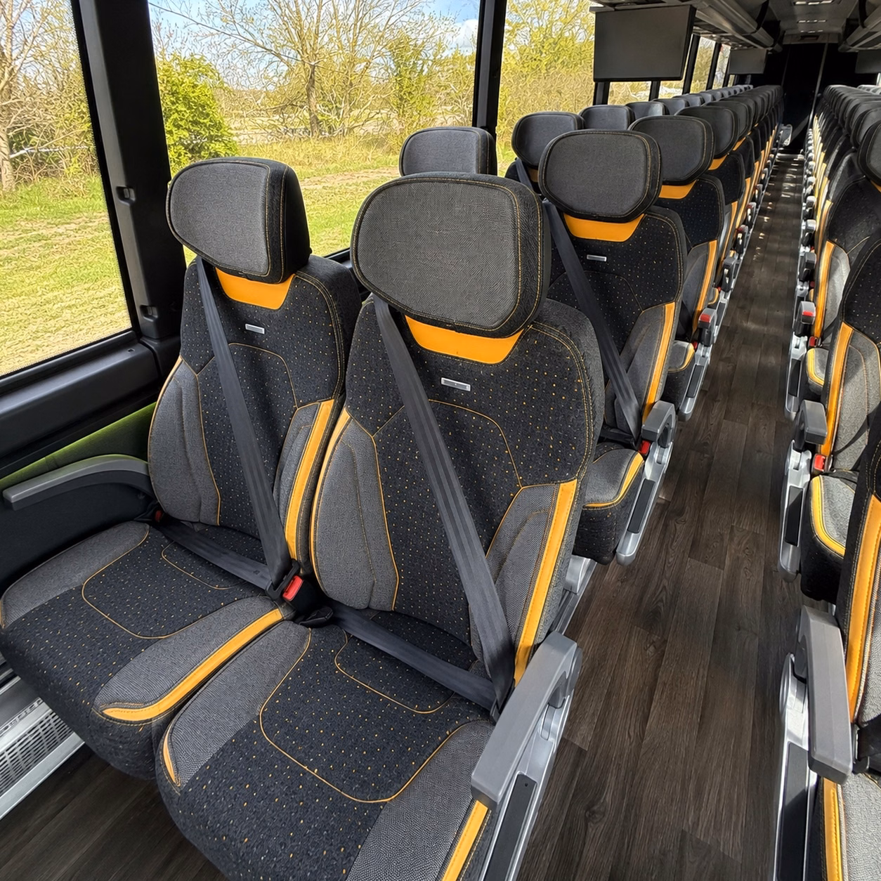 instead of yellow school buses treat your students to a comfortable ride